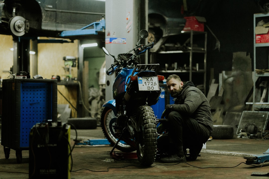 a-man-working-on-a-motorcycle-in-a-garage-ngo4hqk0iko